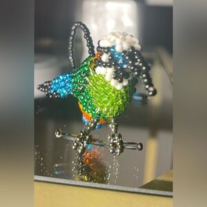 A beautiful ornament Made from tiny beads by the Huichol Indians in Mexico!